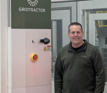 Founder and CEO David Meyers with a DC Fast Charger