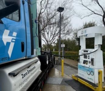 Hydrogen truck being fueled at a public station.