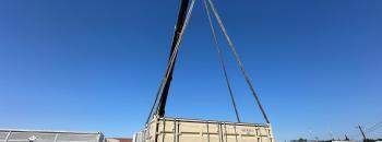 The initial Amber Kinetics Container being placed on its pad at RICU